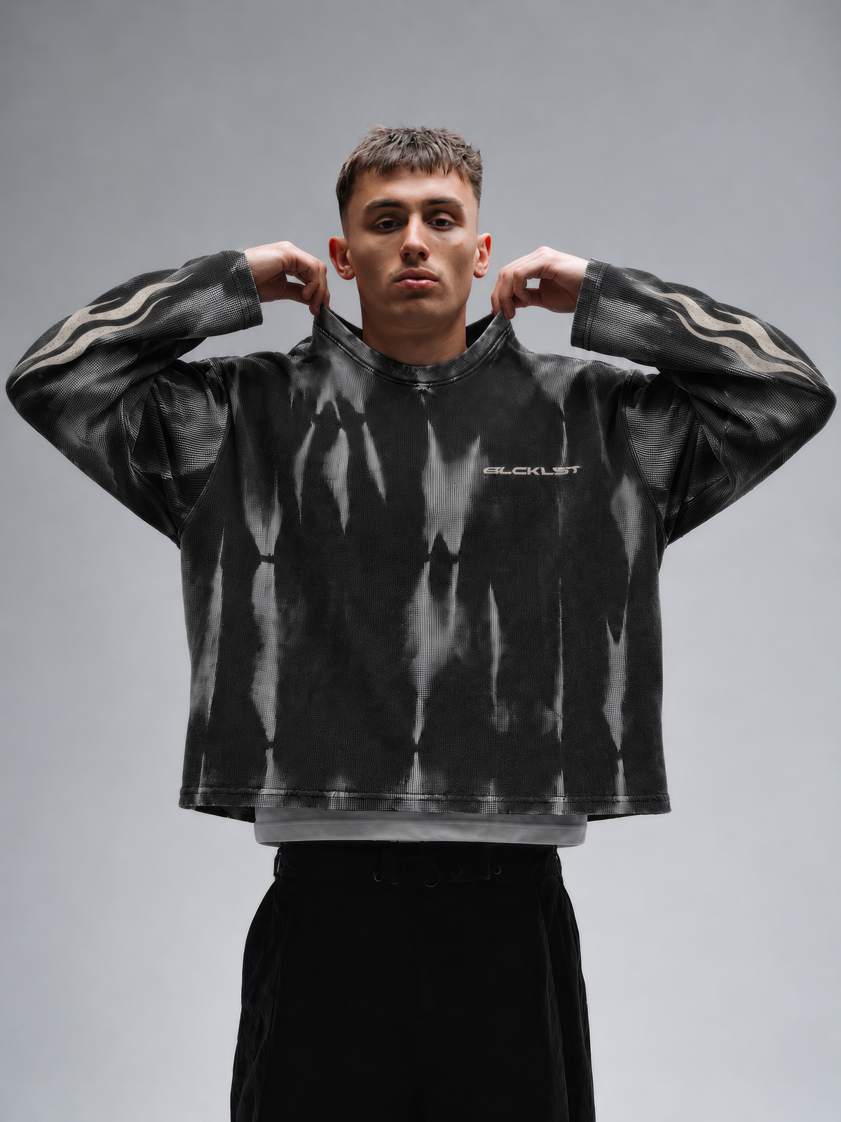BLCKLST Forge Hammer Wash Waffle Full Sleeve T-Shirt 240 GSM in black with distressed grey wash, tribal flame sleeve prints and oversized streetwear fit.