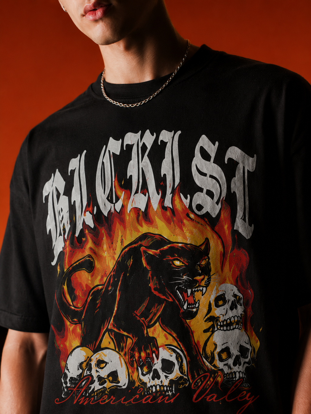 Close-up of Members Only black oversized t-shirt with panther and skull graphic print