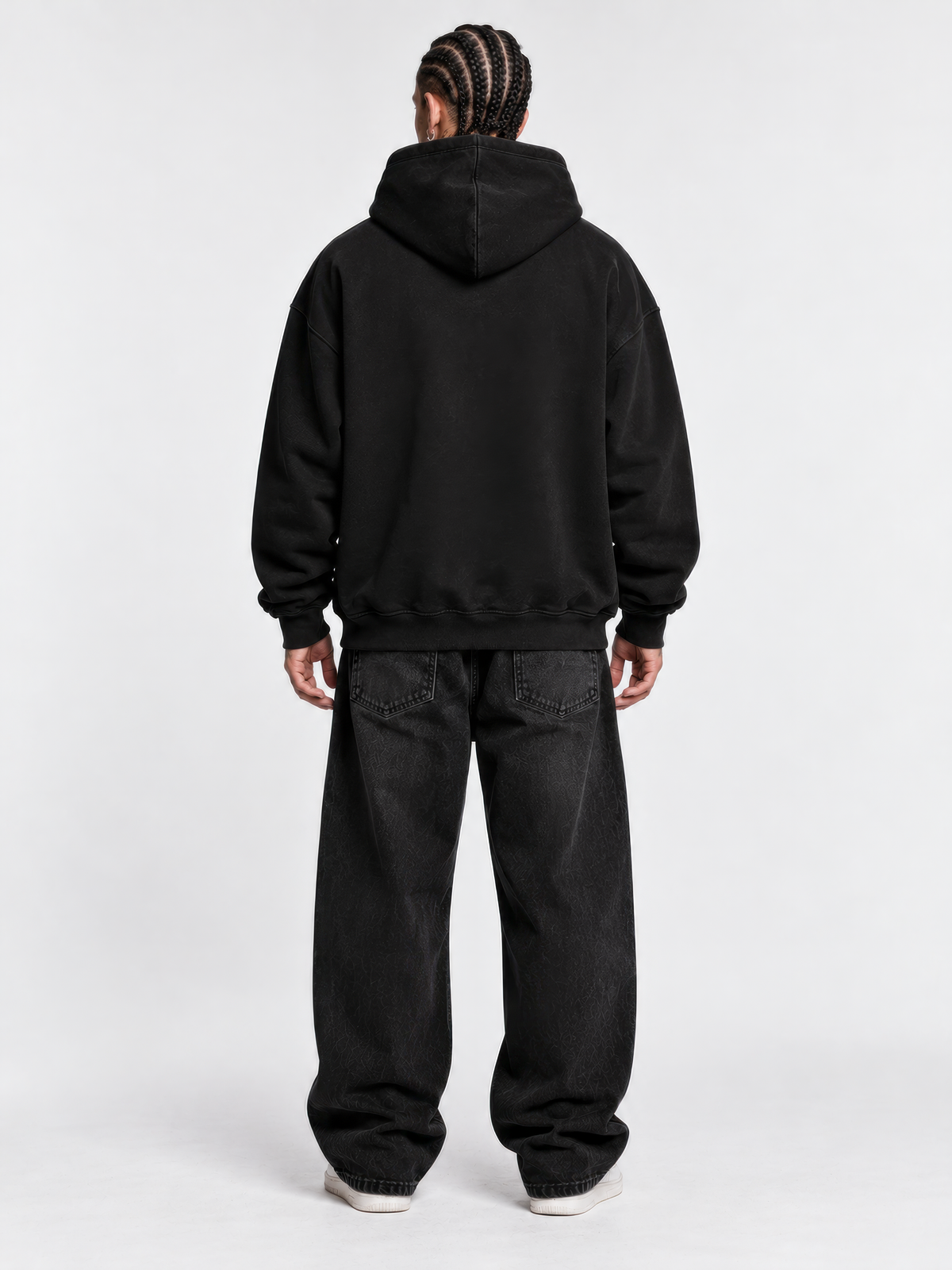 Back view of the BLCKLST Not You Know black oversized hoodie featuring a plain back, adjustable hood, and 350 GSM heavyweight fabric.