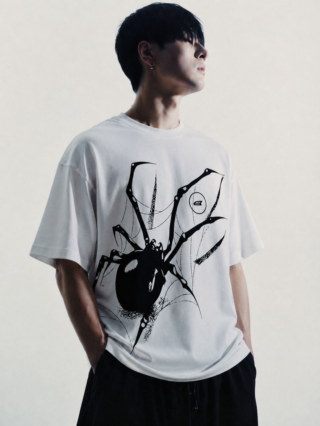 White oversized t-shirt with black Y2K spider graphic front print